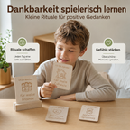 Kind nutzt Dankbarkeitskarten aus Holz, um Dankbarkeit spielerisch zu lernen und positive Gedanken im Alltag zu stärken